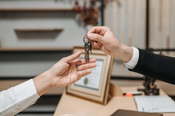 a person handing the keys